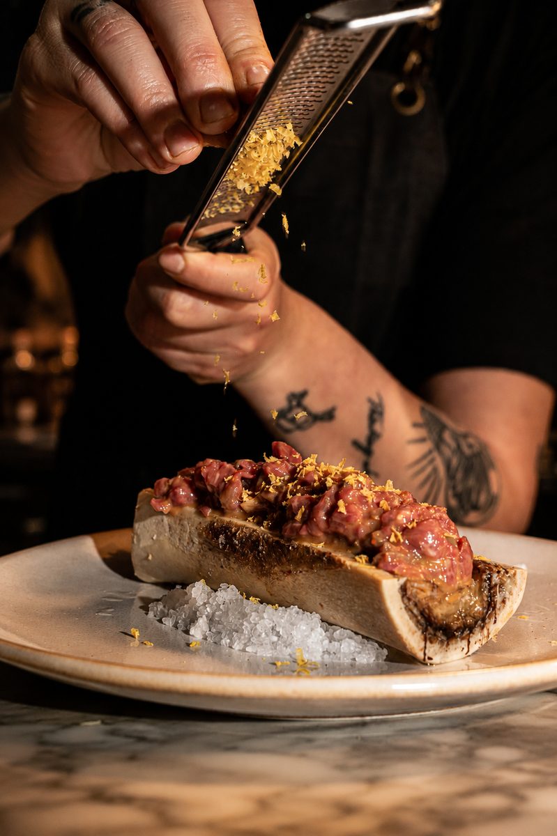 Our chef preparing beef tartare